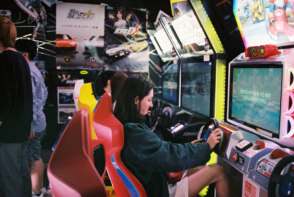 woman driving arcade machine